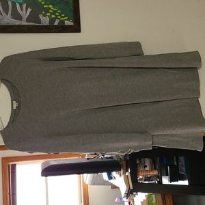 A grey sweater dress with laces on sleeves